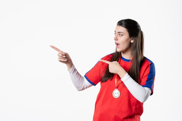 Front view female player in sport clothes with medal