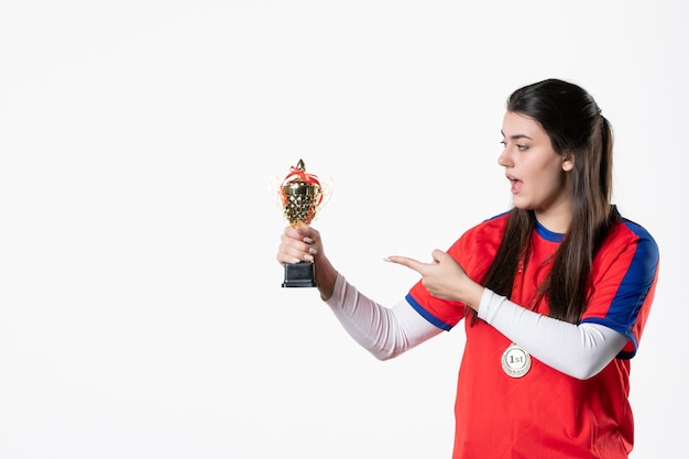 Front view female player with golden cup and medal