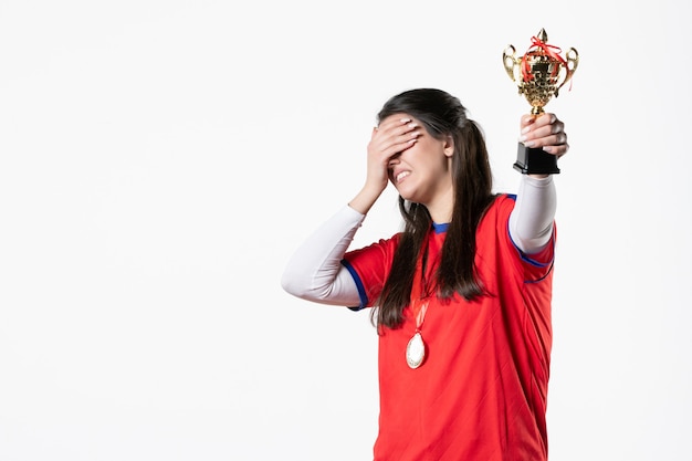 Front view female player with golden cup and medal