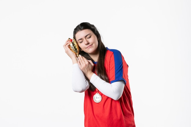 Front view female player with medal and golden cup