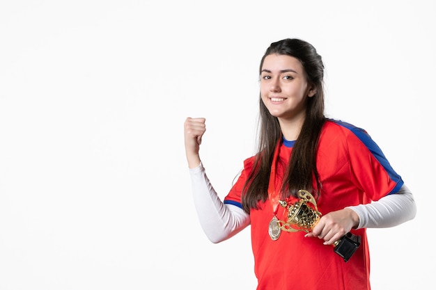 Front view female player with medal and golden cup