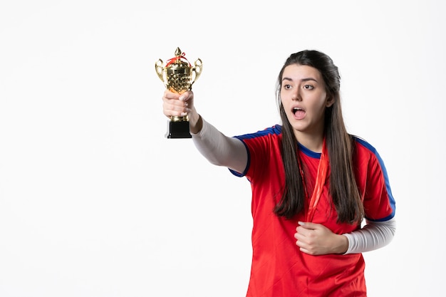 Free photo front view female player with medal and golden cup