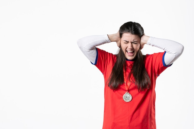 Free photo front view female player with medal stucking her ears