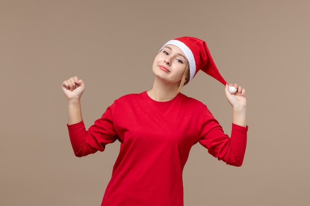 Free photo front view of female in red smiling on brown