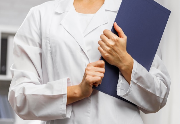 Free photo front view of female researcher with clipboard