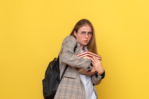 Front view of female student with books