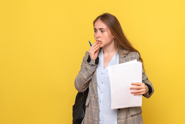 Front view of female student with papers stressed