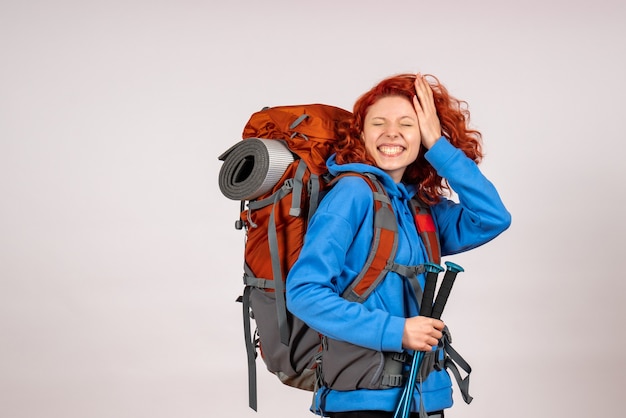 Front view female tourist going in mountain trip