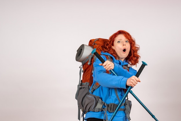 Front view female tourist going in mountain trip