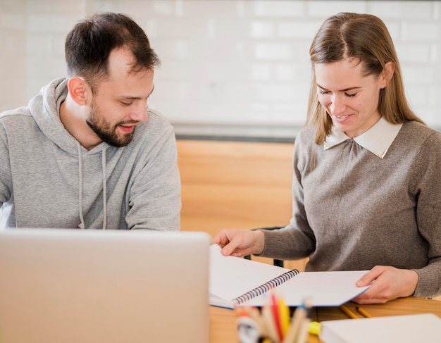 Front view of female tutor and student at home