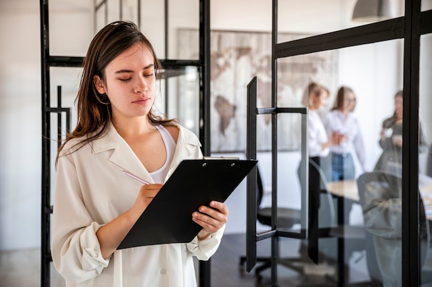 Front view female verifying business plans