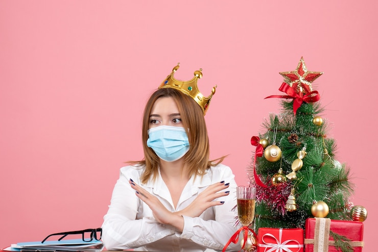 Free Photo front view of female worker in sterile mask with crown on pink