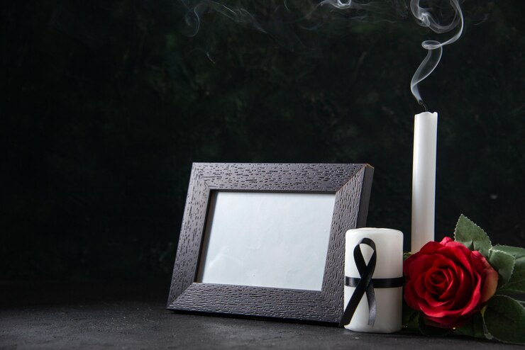 Free Photo front view of fireless candles with picture frame on black