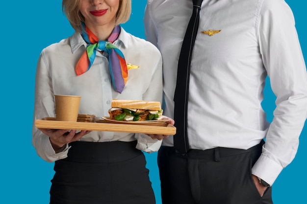 Front view flight attendants with food