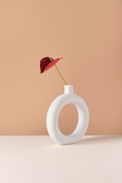 Free photo front view of flower decor in a circle-shaped vase with copy space