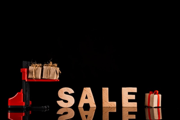 Front view of forklift and letters on black background