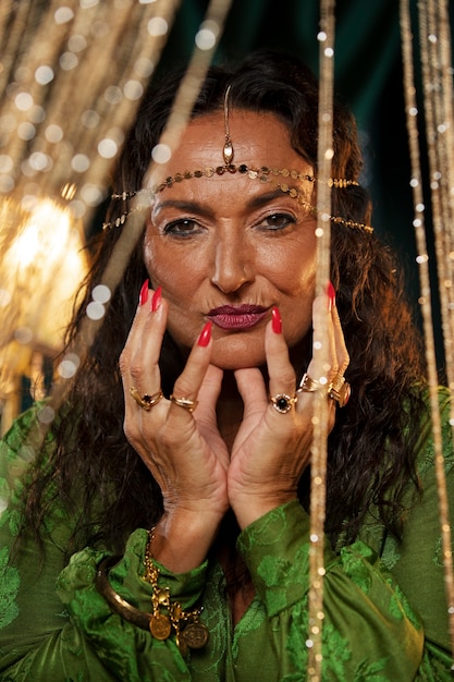 Front view fortune teller posing indoors