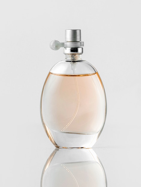 A front view fragrance bottle transparent on the white floor