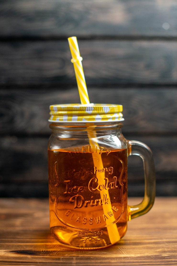 Free Photo front view fresh apple juice inside can with straw on dark cocktail fruit drink photo color