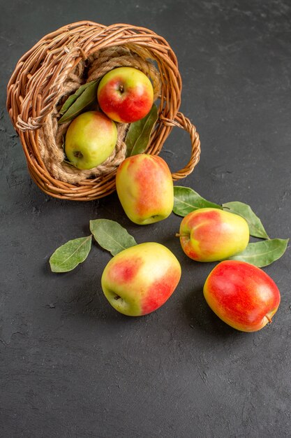Front view fresh apples ripe fruits inside basket on a grey table tree fruit ripe fresh