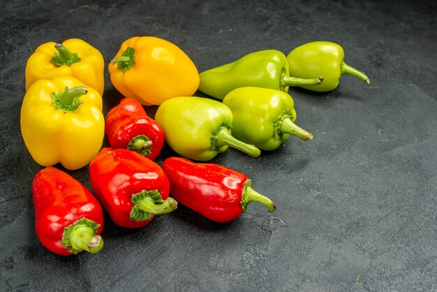Front view fresh bell-peppers on dark background salad food meal ripe photo color