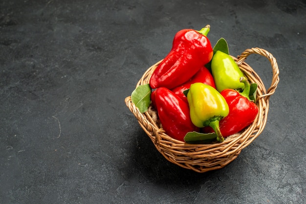 Free photo front view fresh bell-peppers inside basket