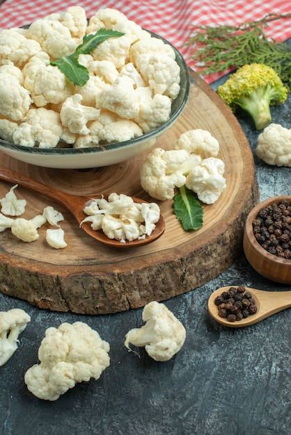 Front view fresh cauliflower with pepper on light-grey surface