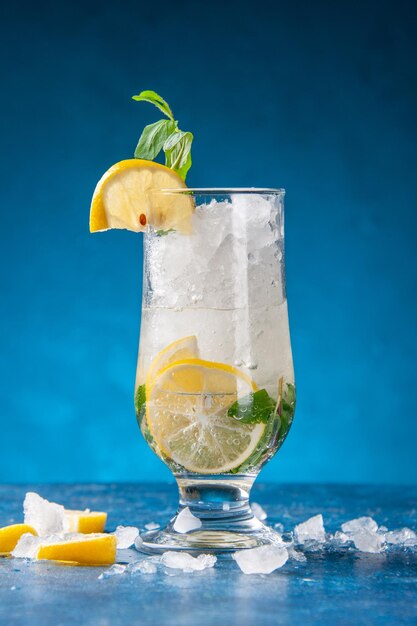 Front view fresh cool lemonade with ice and lemon on blue background fruit water cocktail drink color bar juice cold