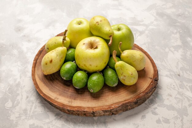 Front view fresh fruits apples feijoa and pears on white space