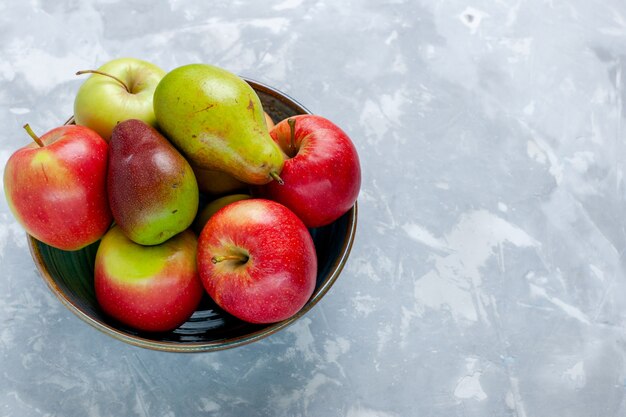 Front view fresh fruits apples and mango on the light white desk fruit fresh mellow ripe tree photo