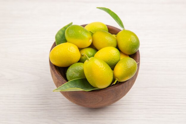 Front view fresh fruits inside plate on white background color fruit tropical exotic ripe diet