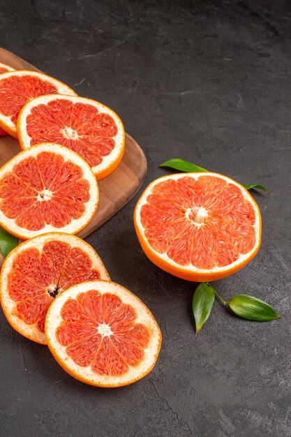 Front view fresh grapefruit slices on dark table