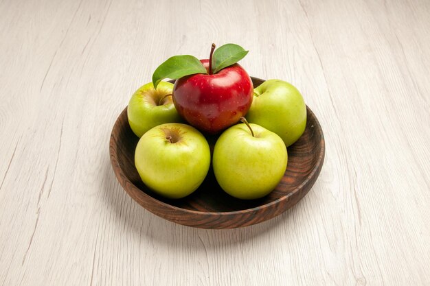 Front view fresh green apples ripe and mellow fruits on white desk fruit color tree fresh plant red