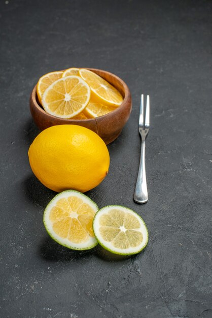 Front view fresh lemon slices on a dark background