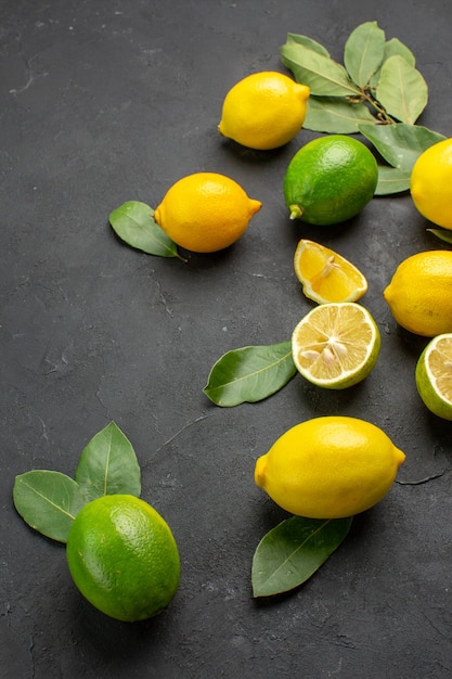 Front view fresh lemons sour fruits on a dark background