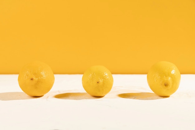 Front view fresh lemons on table