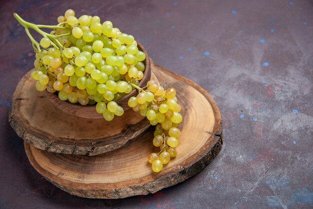 Front view fresh mellow grapes on dark surface wine fresh grape fruits ripe tree plant