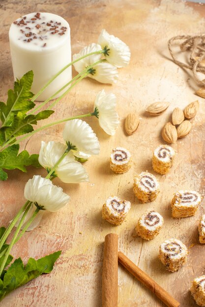 Free photo front view of fresh nuts with candies on wooden surface