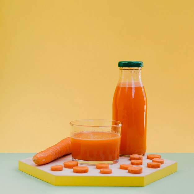 Front view fresh and organic carrot juice 