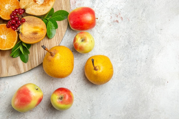 Front view fresh quinces with other fruits on light white table ripe fruit mellow fresh