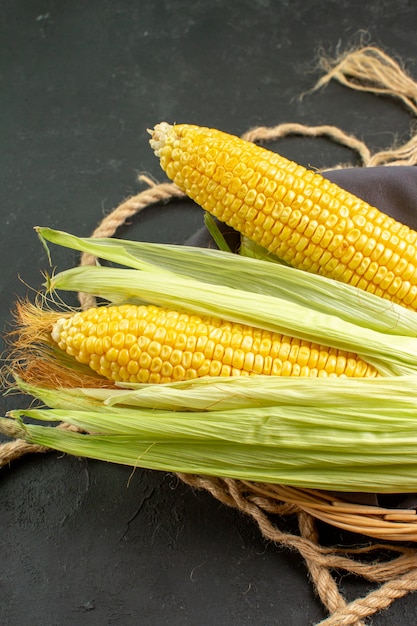Front view fresh raw corns inside basket