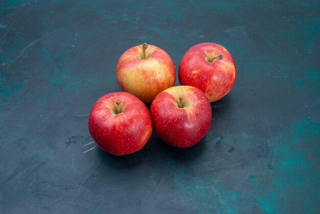 Front view fresh red apples mellow and fresh fruits on dark-blue desk fruit fresh mellow ripe tree