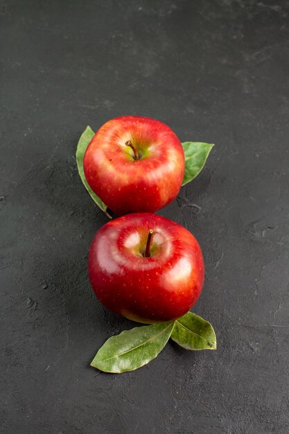 Front view fresh red apples mellow fruits on a dark table fruit red fresh ripe tree