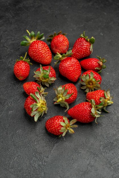 Front view fresh red strawberries on grey background color  berry tree juice summer wild