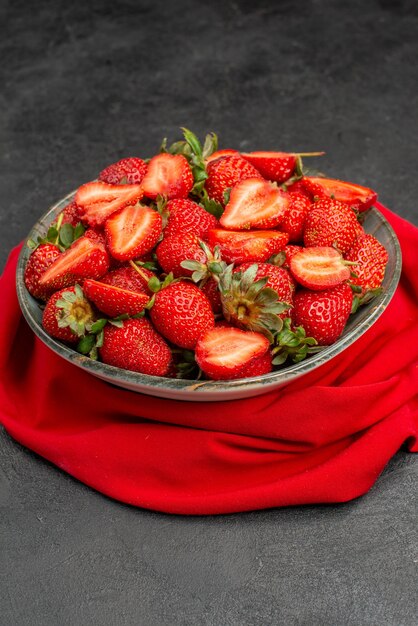 Front view fresh red strawberries inside plate on dark background berry summer color tree juice wild