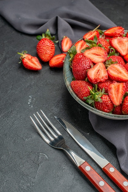 Free photo front view fresh red strawberries inside plate with cutlery on a dark background color wild berry summer juice  tree