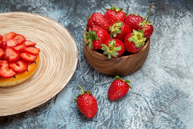 Front view of fresh red strawberries with pancake on light surface