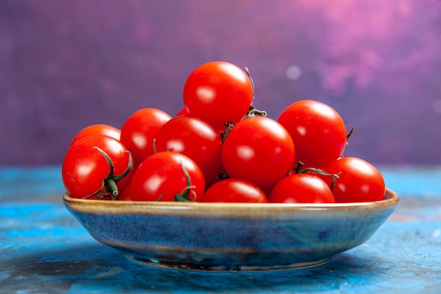 Front view fresh red tomatoes inside plate on blue table photo food vegetable salad color