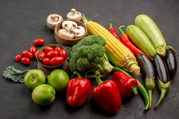 Front view fresh ripe vegetables composition on dark table ripe fresh color