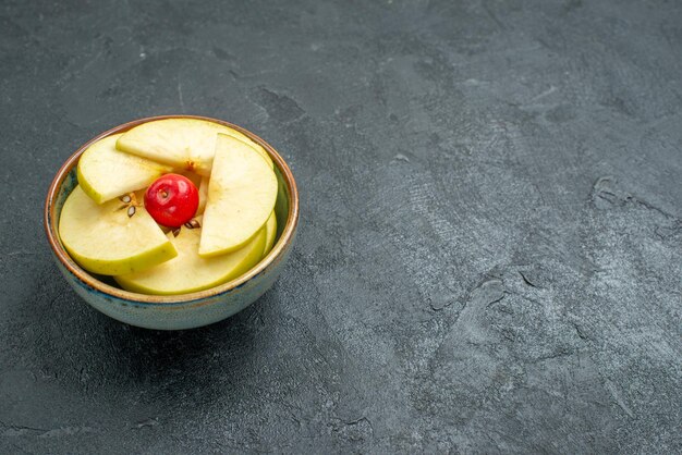 Front view fresh sliced apples inside little pot on a grey background fresh fruit mellow ripe